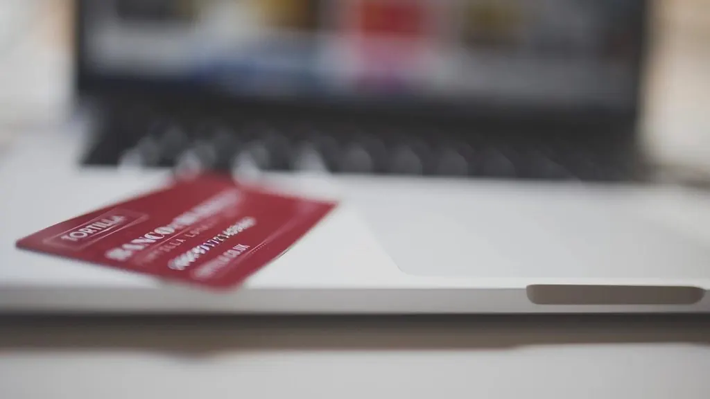 Payment card resting on a laptop keyboard